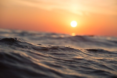 Waves on the ocean at sunset