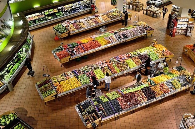 a well-stocked grocery store produce section