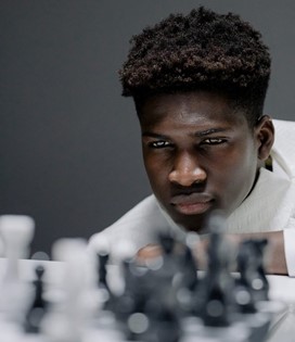 a man thinking hard about chess