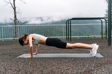 a woman with very little muscle doing a push-up