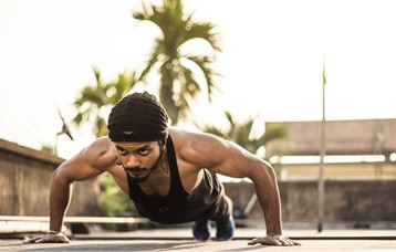 A strong, determined man doing push-ups