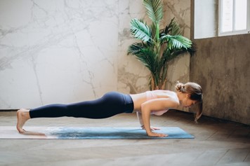 A fit woman doing a push-up