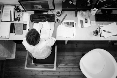 a man working hard at a desk