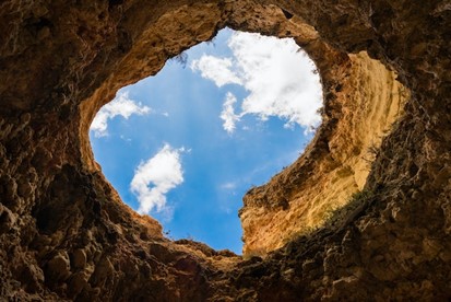 The view of the sky from down in a hole.