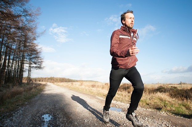 A man running on a cold morning