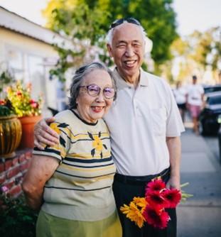 an older couple beaming with happiness