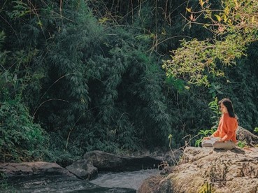 A woman meditating in nature