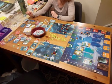 My wife and I playing a game called Underwater Cities.