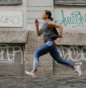 a woman running in the street