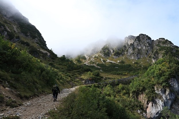 Some hiking up a mountain