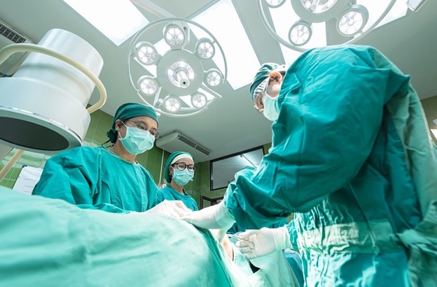 a team of surgeons performing an operation