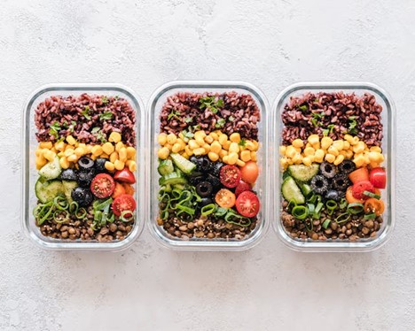 three identical meals prepped in separate containers