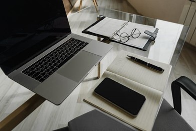 A desk with multiple productivity tools on it