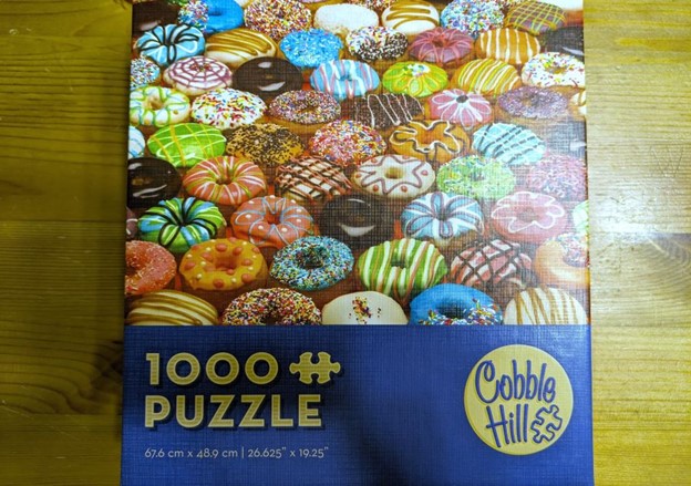 a jigsaw puzzle where the picture is donuts