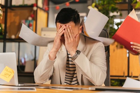 an overwhelmed office worker