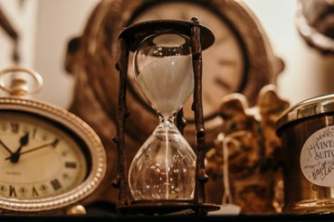 an hourglass with sand falling