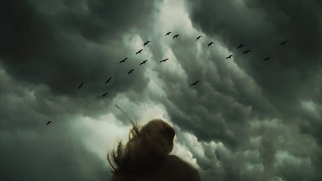 Someone facing stormy weather head-on