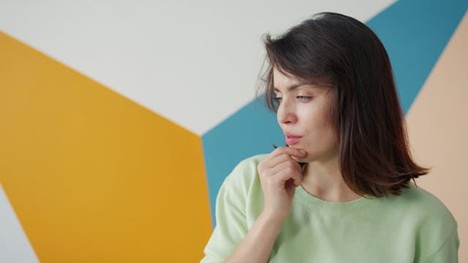 a woman carefully thinking about what she's going to say