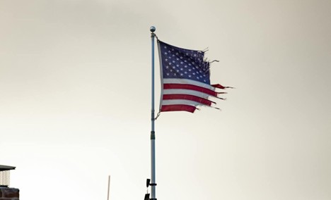 a torn and tattered American flag